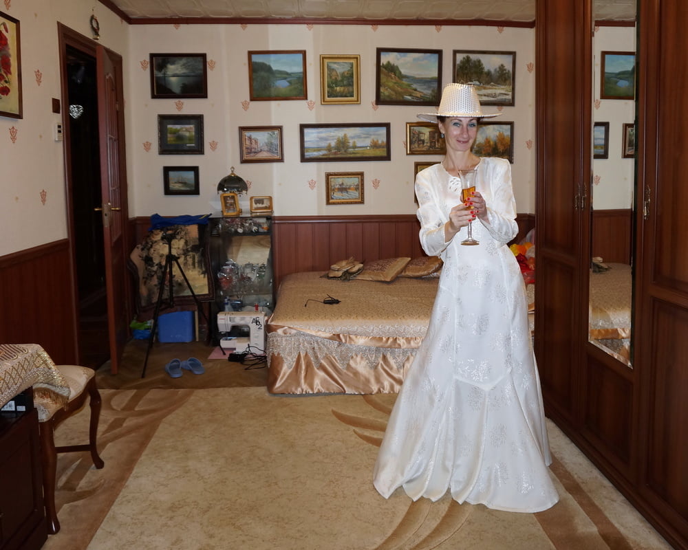 In Wedding Dress and White Hat #107138404