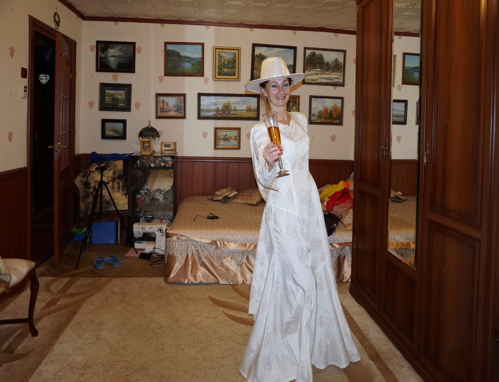 In Wedding Dress and White Hat #107138408