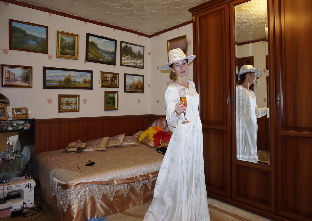 In Wedding Dress and White Hat #107138410