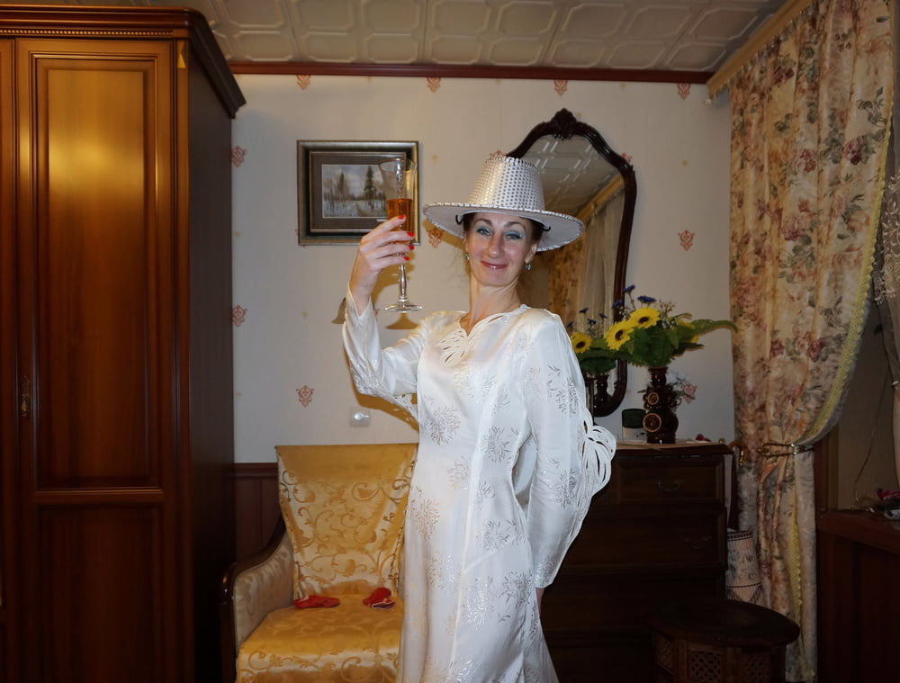 In Wedding Dress and White Hat #107138412