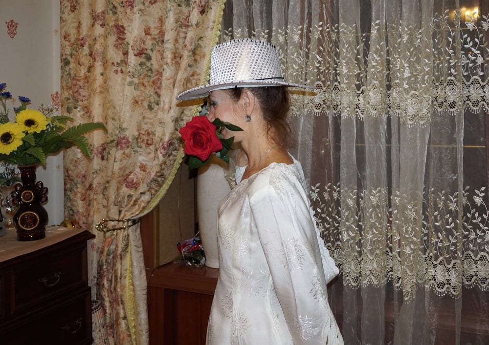 In Wedding Dress and White Hat #107138414