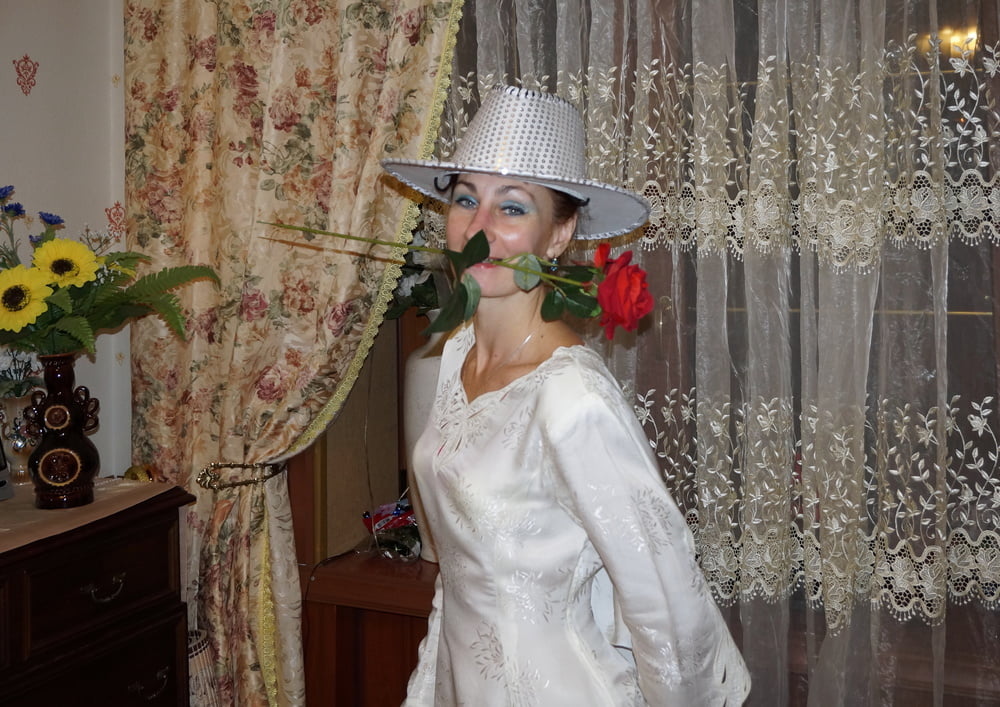 In Wedding Dress and White Hat #107138415