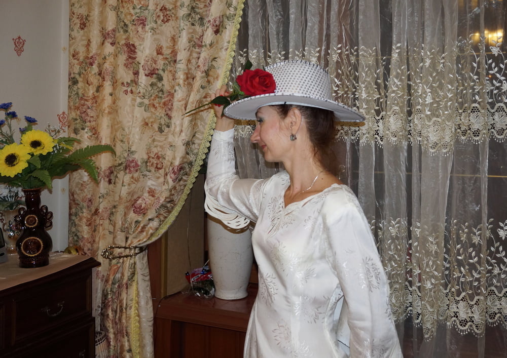 In Wedding Dress and White Hat #107138417