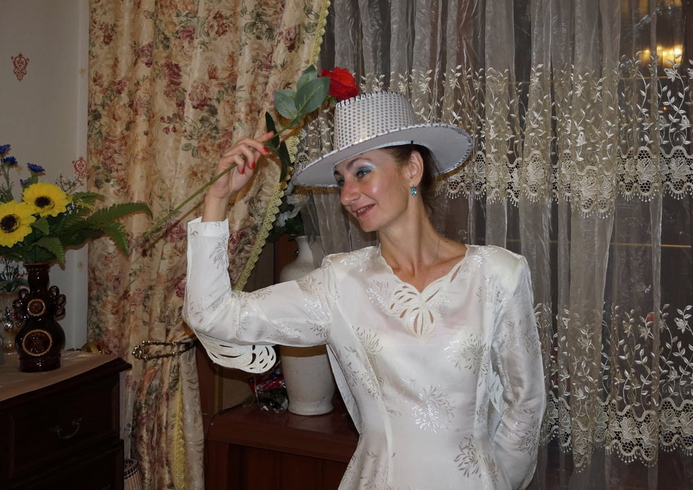 In Wedding Dress and White Hat #107138418