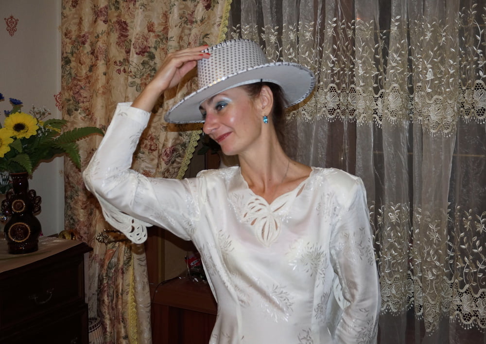 In Wedding Dress and White Hat #107138419