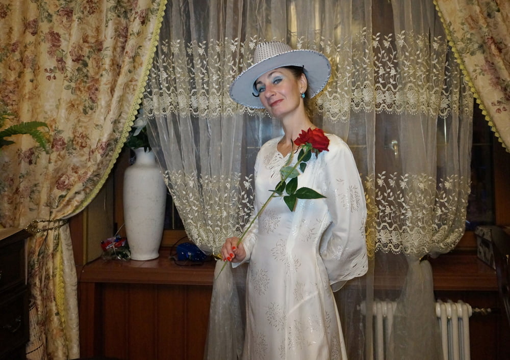 In Wedding Dress and White Hat #107138420