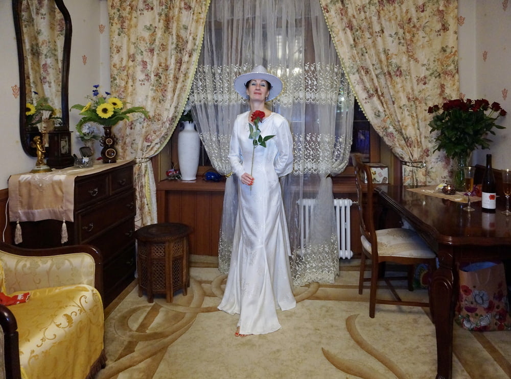 In Wedding Dress and White Hat #107138423