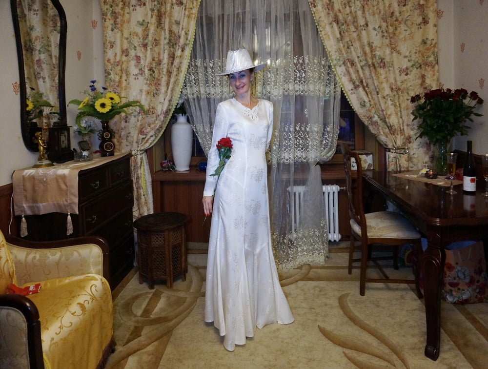 In Wedding Dress and White Hat #107138424