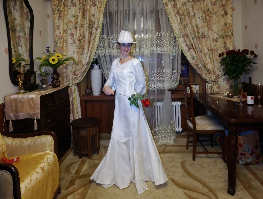 In Wedding Dress and White Hat #107138425