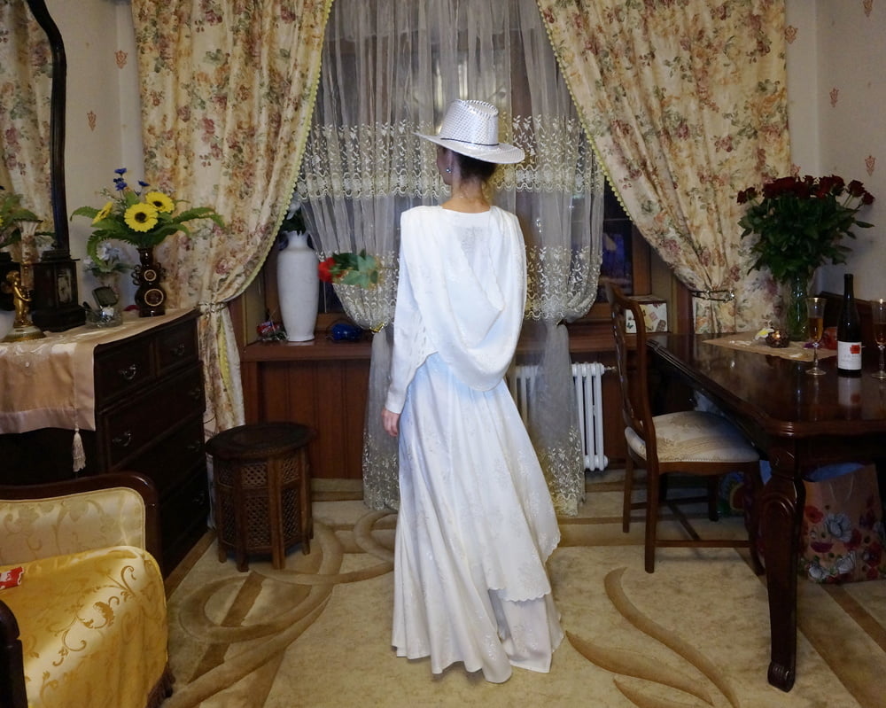 In Wedding Dress and White Hat #107138426