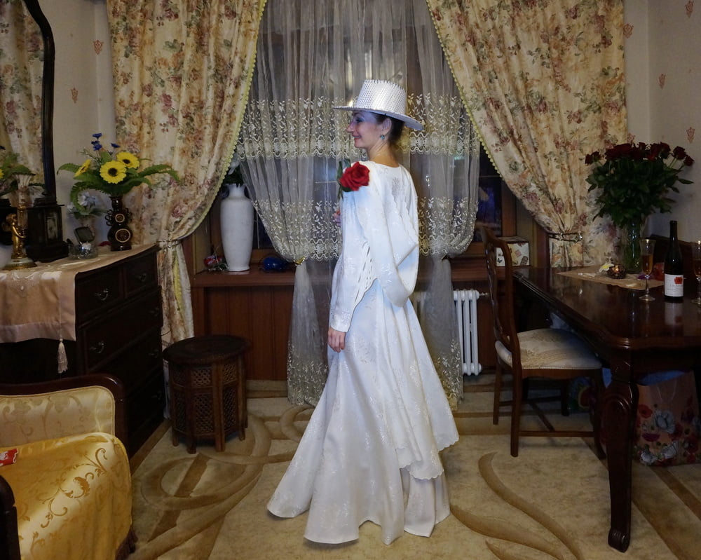 In Wedding Dress and White Hat #107138427