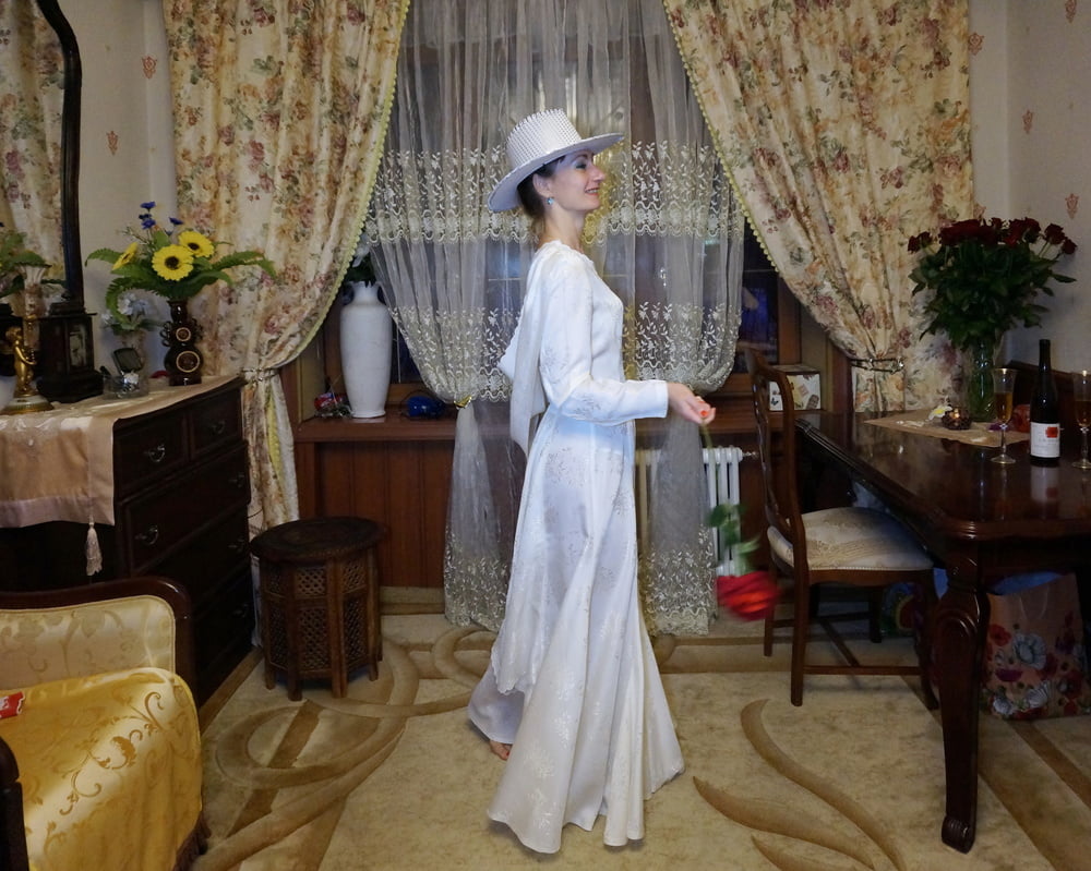 In Wedding Dress and White Hat #107138428