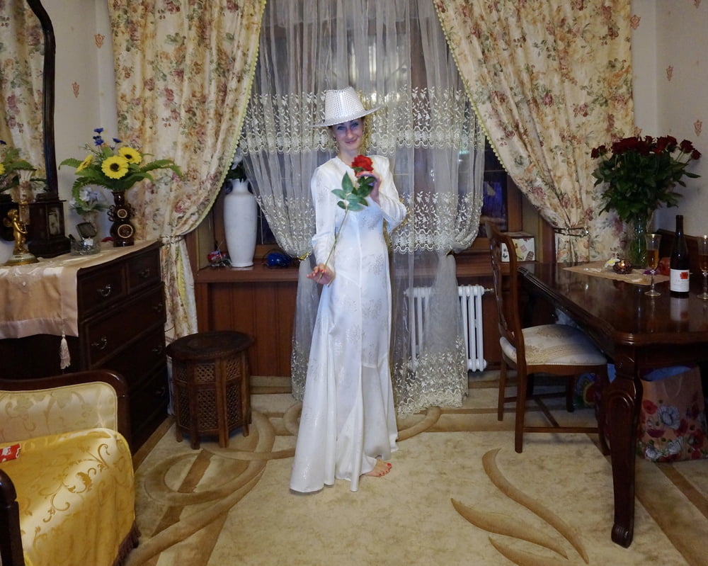 In Wedding Dress and White Hat #107138429