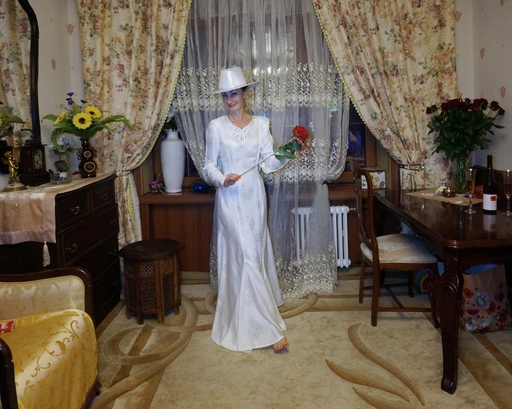 In Wedding Dress and White Hat #107138430