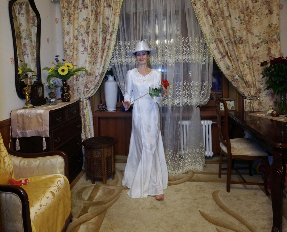 In Wedding Dress and White Hat #107138431