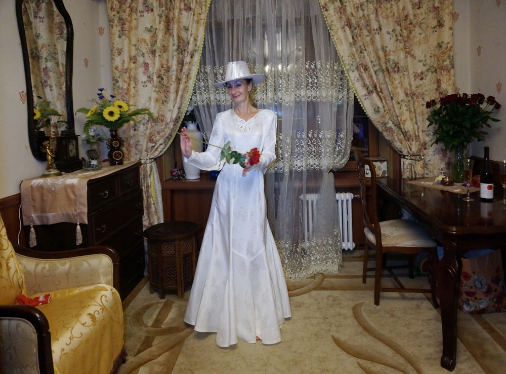 In Wedding Dress and White Hat #107138432