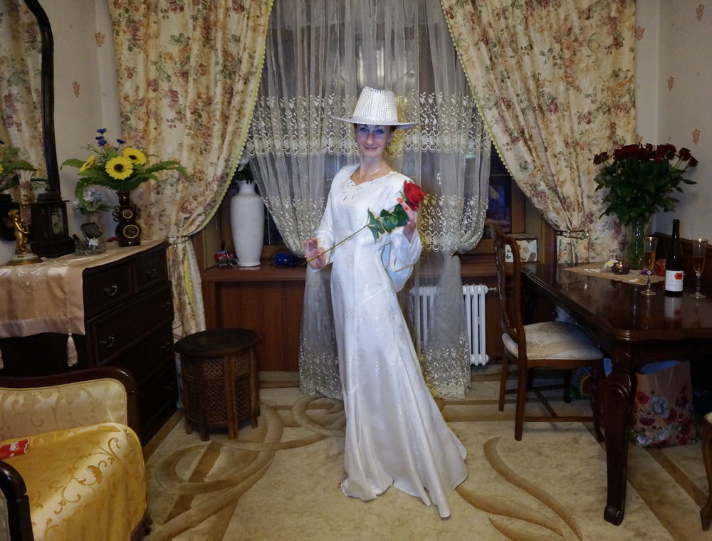 In Wedding Dress and White Hat #107138433