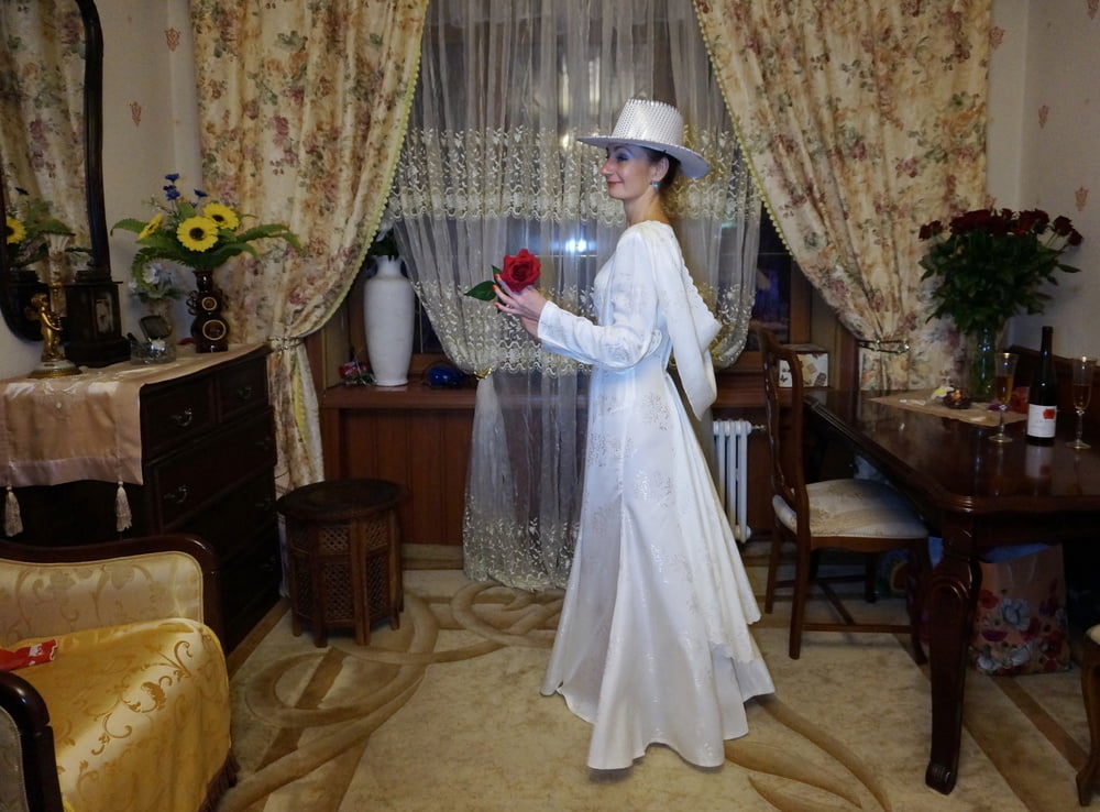 In Wedding Dress and White Hat #107138434