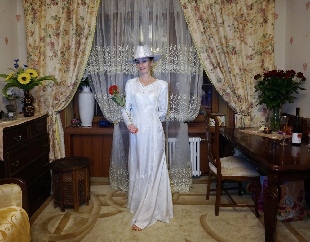 In Wedding Dress and White Hat #107138435