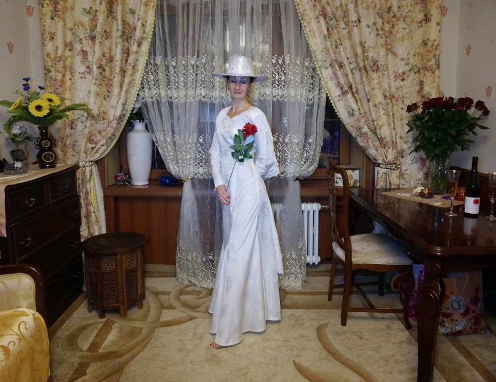 In Wedding Dress and White Hat #107138436