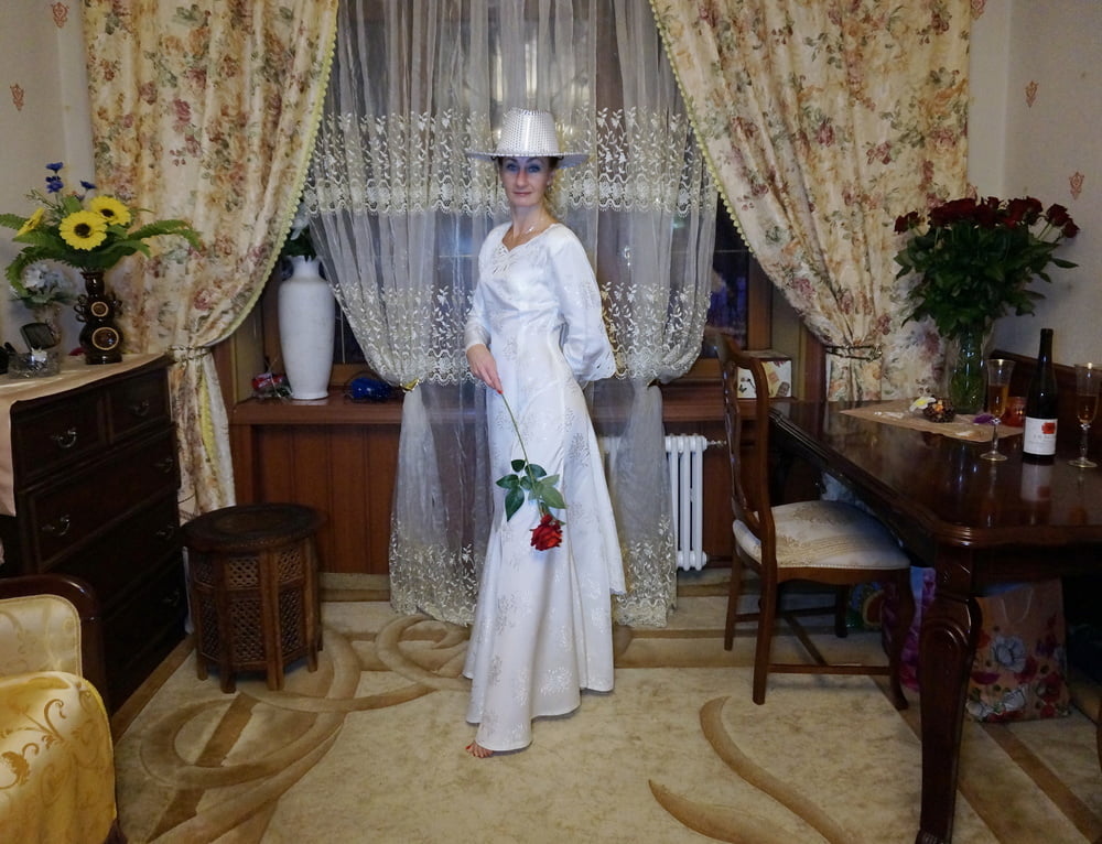 In Wedding Dress and White Hat #107138437