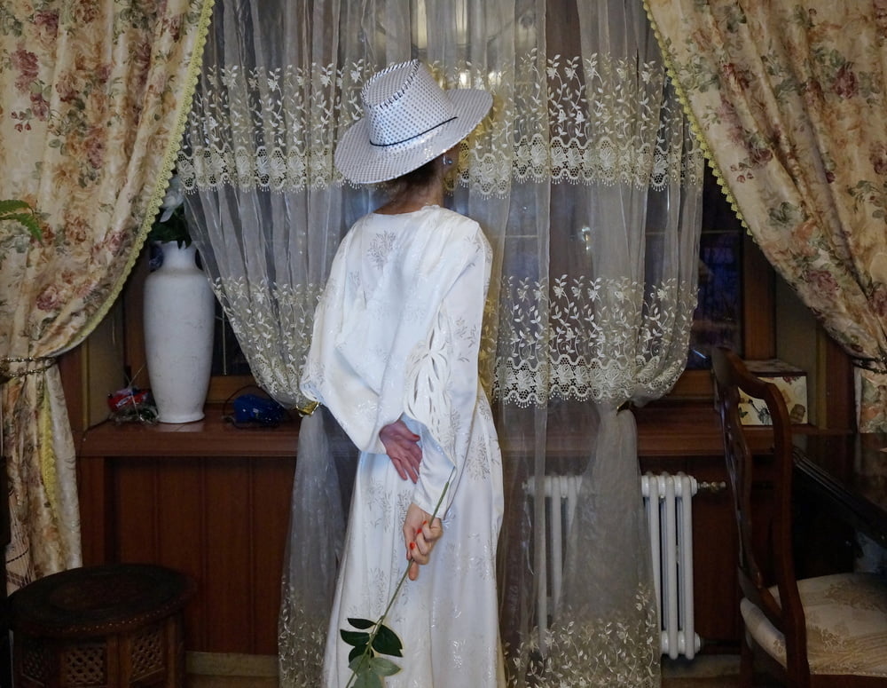 In Wedding Dress and White Hat #107138438