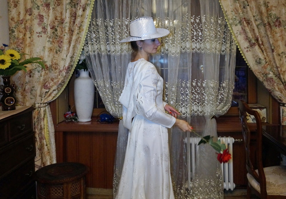 In Wedding Dress and White Hat #107138439
