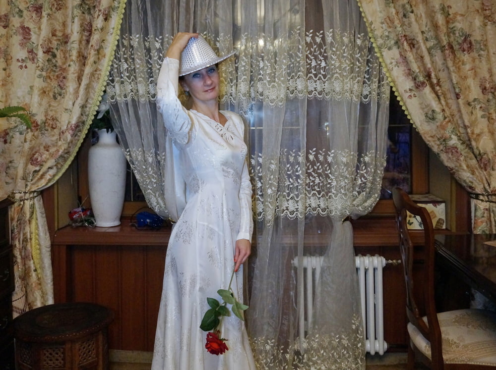 In Wedding Dress and White Hat #107138440
