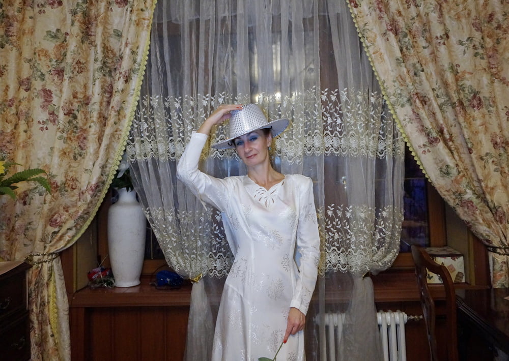 In Wedding Dress and White Hat #107138441
