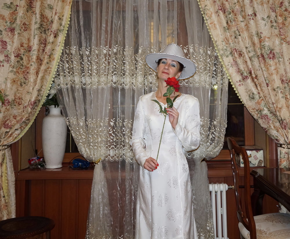In Wedding Dress and White Hat #107138442