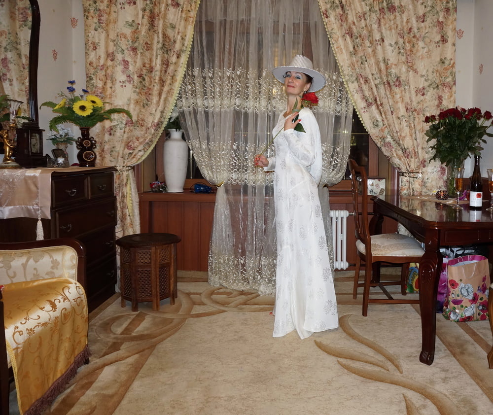 In Wedding Dress and White Hat #107138443