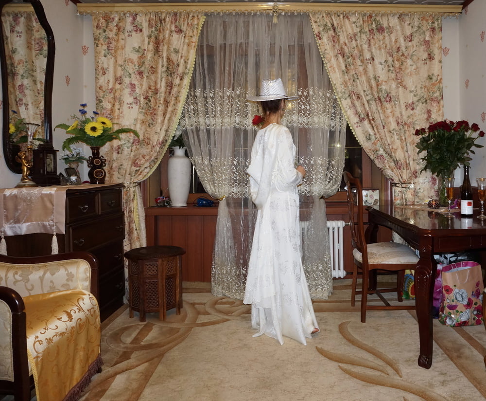 In Wedding Dress and White Hat #107138444