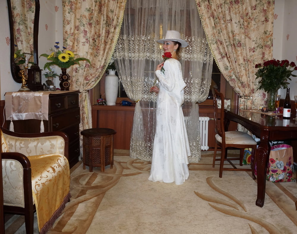 In Wedding Dress and White Hat #107138445