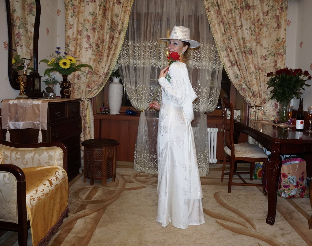 In Wedding Dress and White Hat #107138446