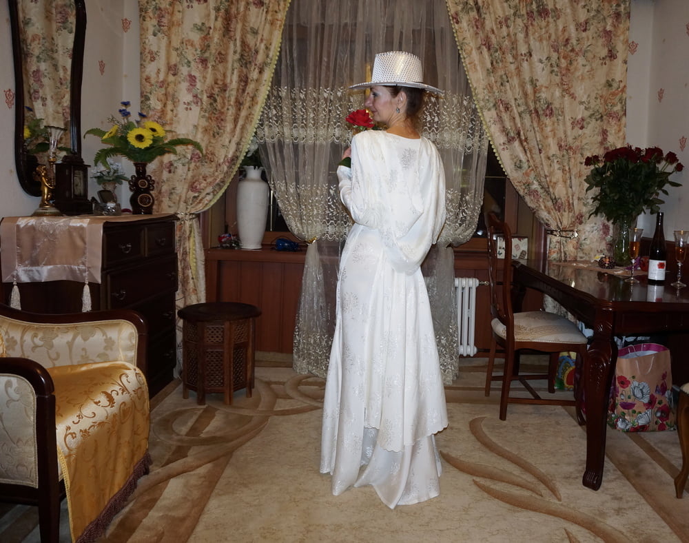 In Wedding Dress and White Hat #107138447
