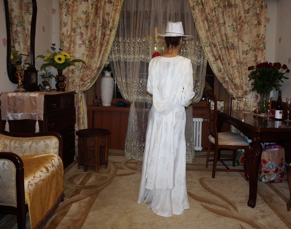 In Wedding Dress and White Hat #107138448