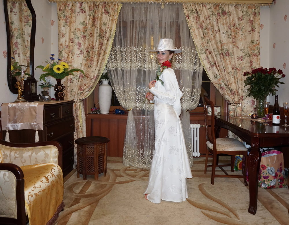 In Wedding Dress and White Hat #107138451
