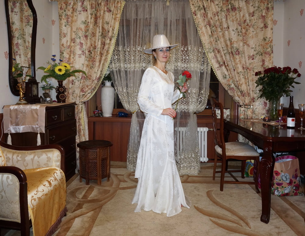 In Wedding Dress and White Hat #107138453