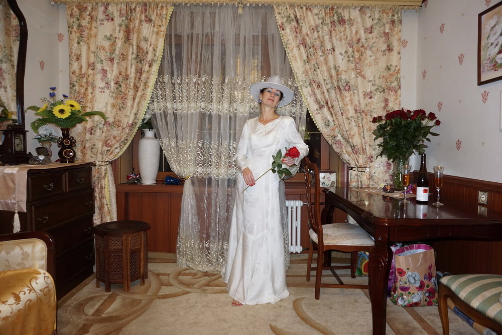 In Wedding Dress and White Hat #107138454