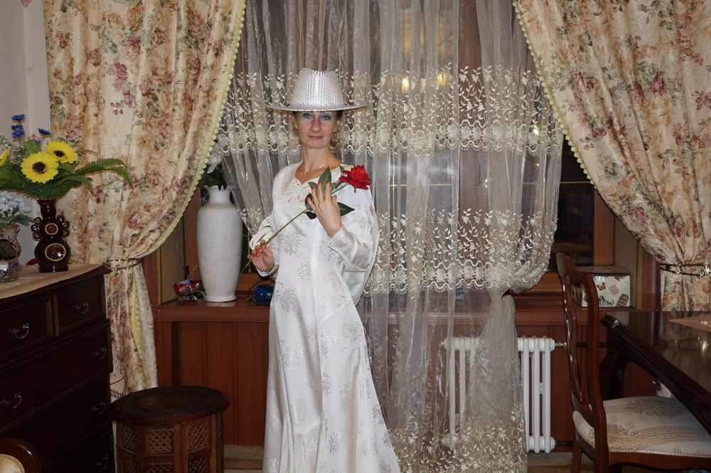 In Wedding Dress and White Hat #107138458
