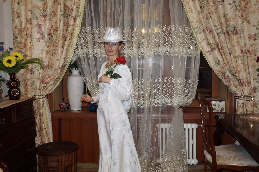 In Wedding Dress and White Hat #107138459