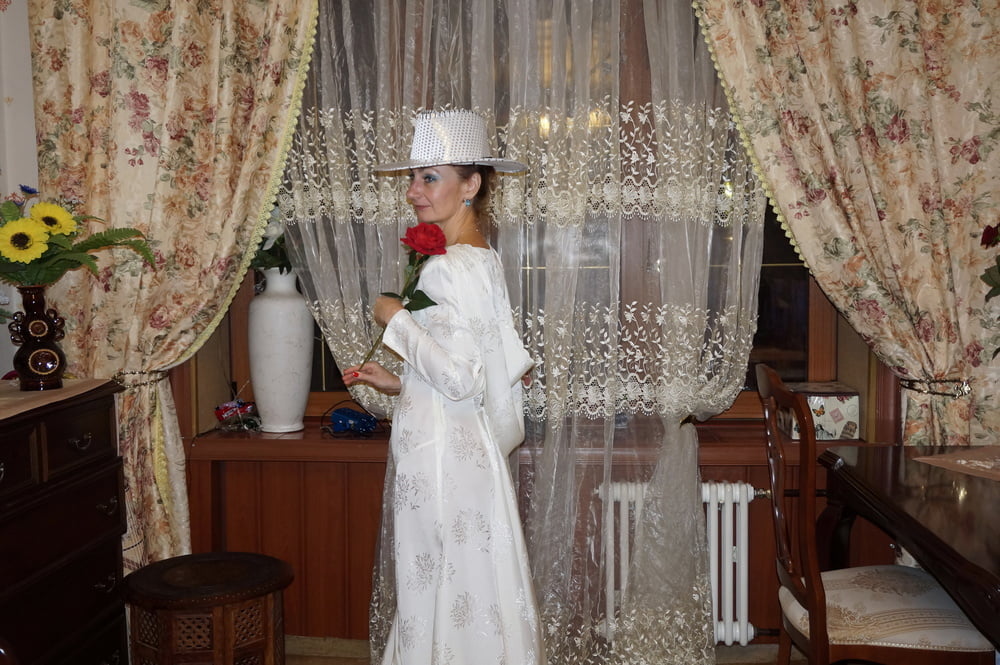 In Wedding Dress and White Hat #107138460