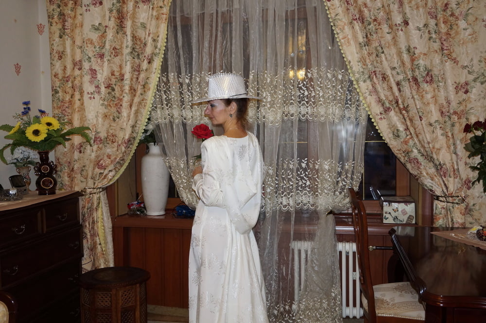 In Wedding Dress and White Hat #107138461