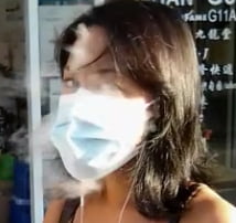 タイトなアジア人がマスクをしてタバコを吸う
 #80175018