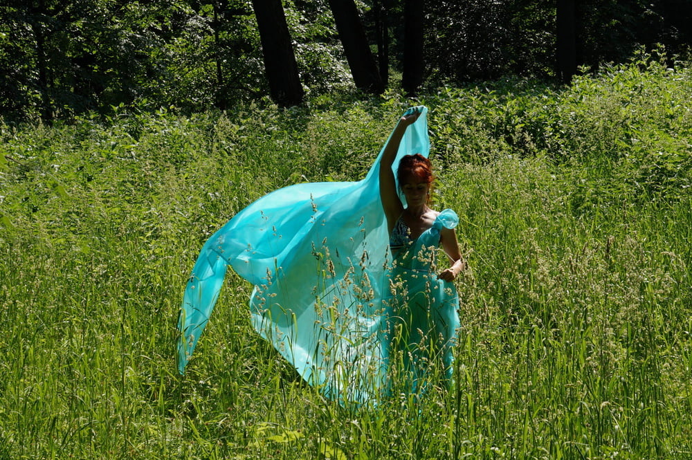 With a turquoise veil in the contrlight #107047410