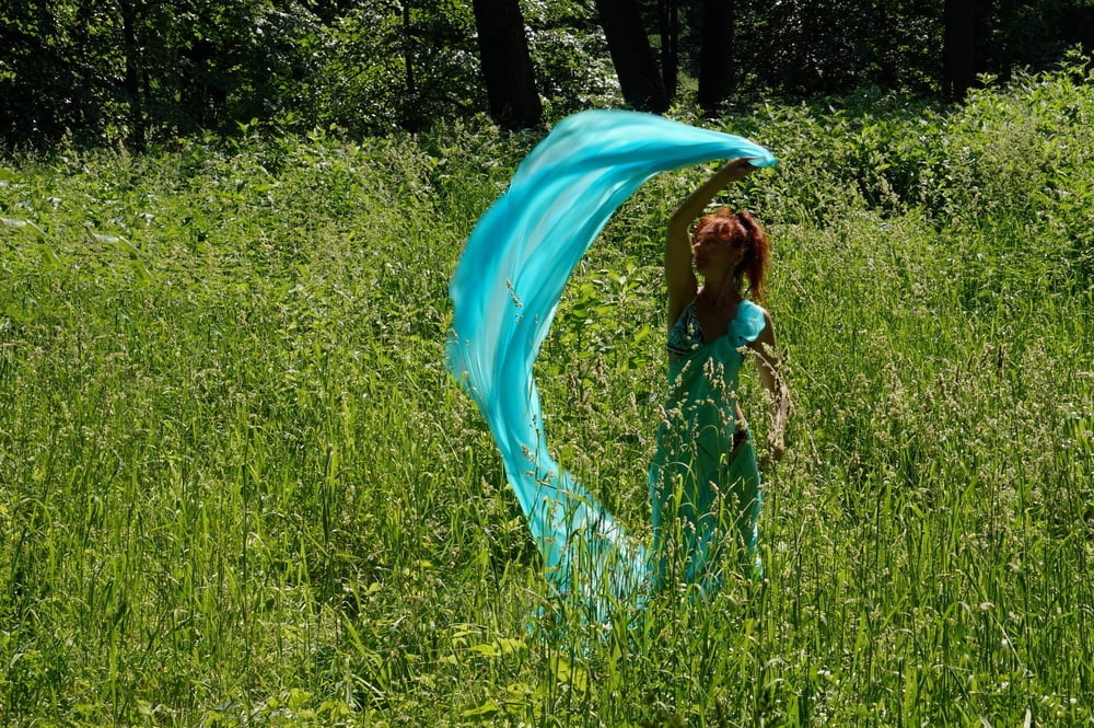 With a turquoise veil in the contrlight #107047423