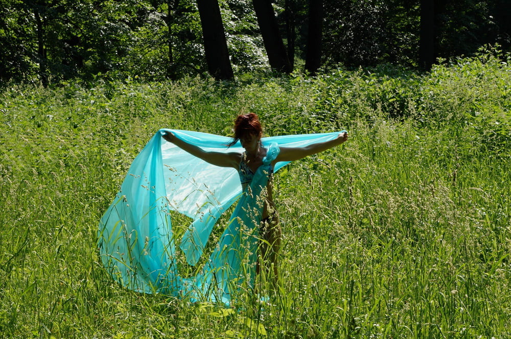 With a turquoise veil in the contrlight #107047466