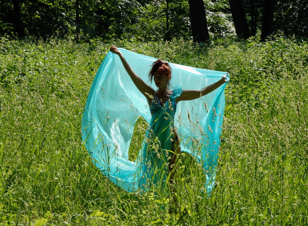 With a turquoise veil in the contrlight #107047476