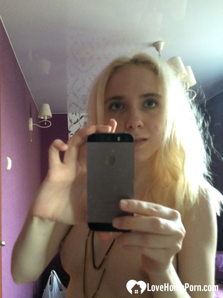 Skinny blonde cutie taking a couple of selfies #106776094