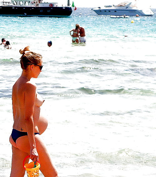 Pregnant Nudist on Beach #107296464